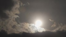 Timelapse of sun behind stormy clouds