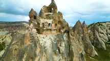 Drone aerial shot of Cappadocia Ancient architecture cave houses facade
