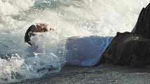 Soldier overwhelmed by ocean waves