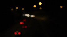 Cars with Soft Focus Lights at Night Driving on a Motorway with an On Ramp, Ireland