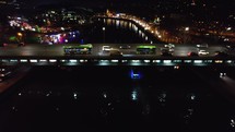 Bus and cars on the bridge at the night