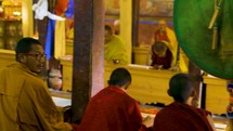 Buddhist monks sitting at a table