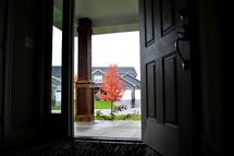 open front door and red fall tree 