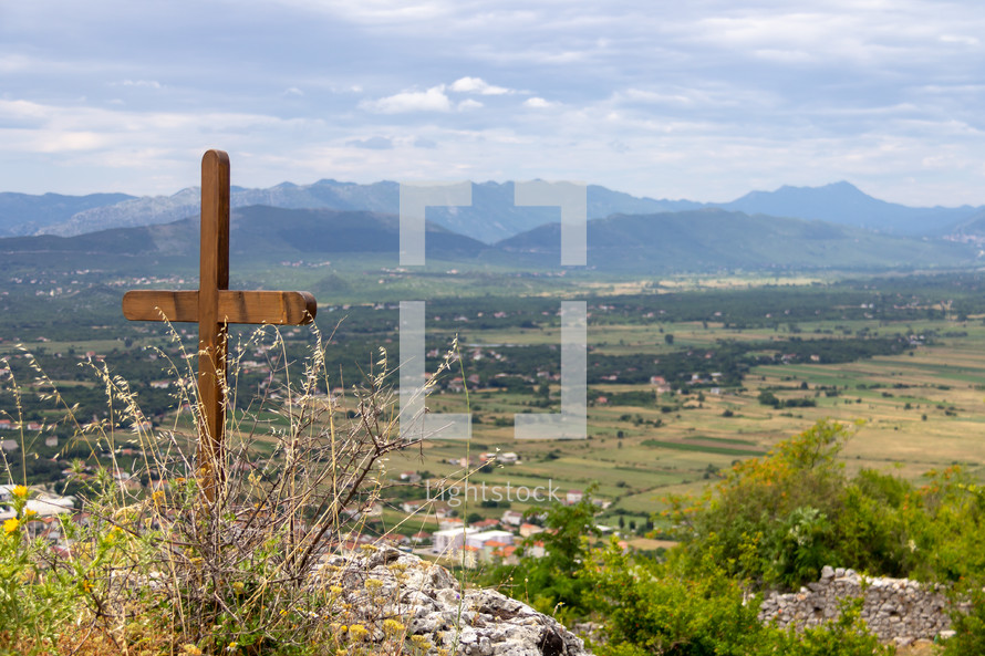 Cross at the Ljubuski Fortress in Bosnia and Herzegovina overlooking the valley below