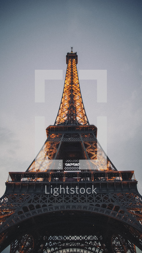 Paris Eiffel Tower lights at sunset 