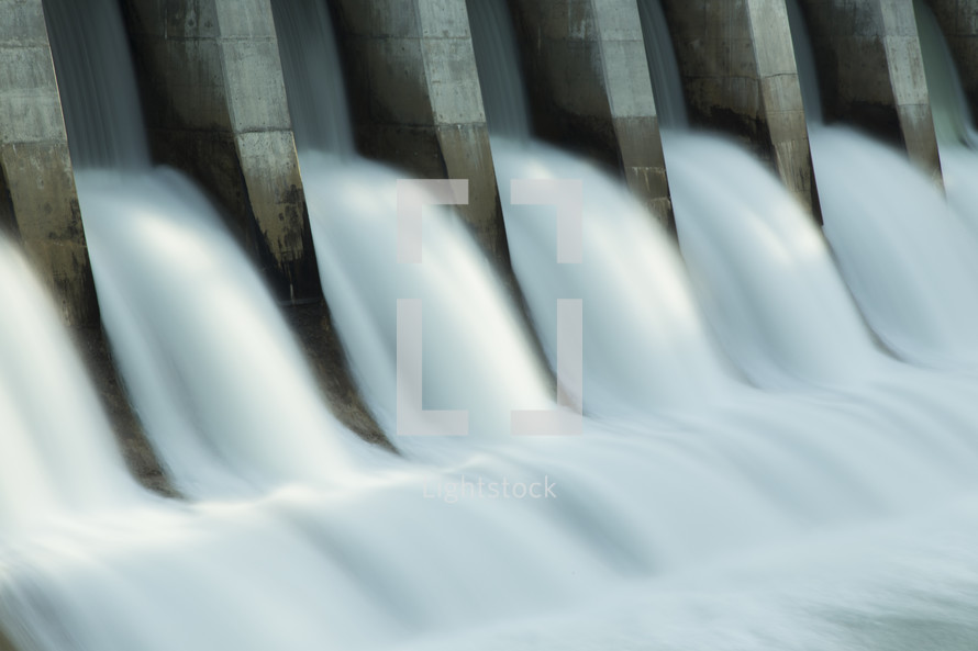 water flowing through a hydroelectric dam