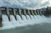 water flowing through a hydroelectric dam 