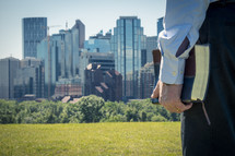 man with Bible and City Skyline 