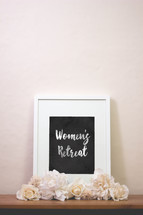 word women's retreat in a frame