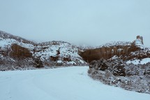 snow on red rock cliffs 