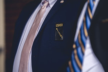 user name tag on a lapel 