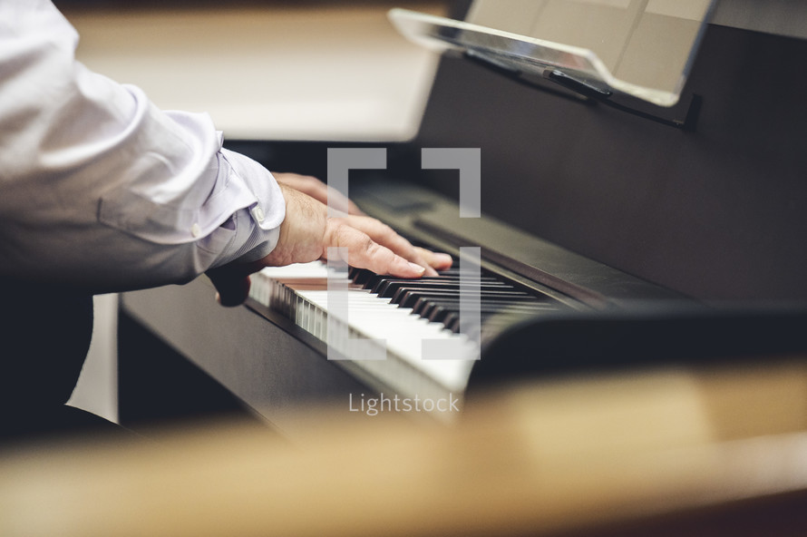 man playing a piano at church 
