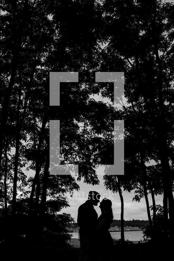 silhouette of a couple embracing 