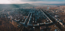 Aerial panorama of town at sunset