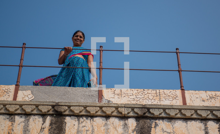 a woman on a balcony in Kumbalgara