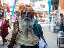 a man with face painted in India 