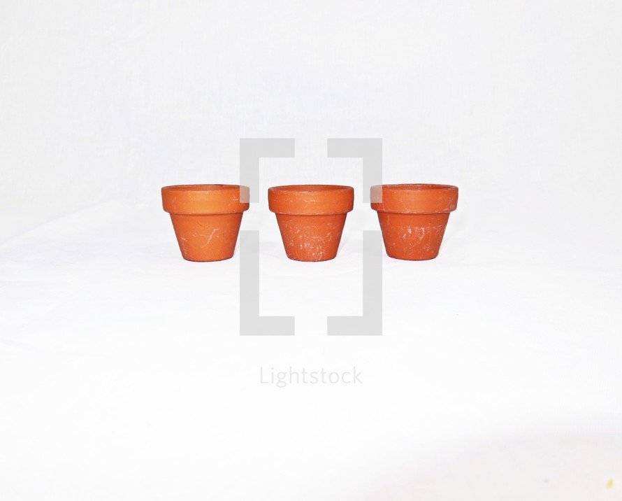 three small terra cotta pots