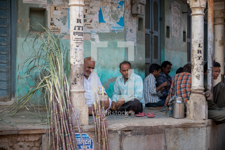 men sitting on a porch in Mandawa, India 