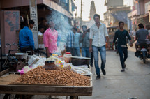 roasting peanuts on a street in India 