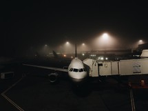 airplane on the tarmac at night 
