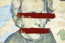 red lines on eyes and mouth of Andrew Jackson on US currency 