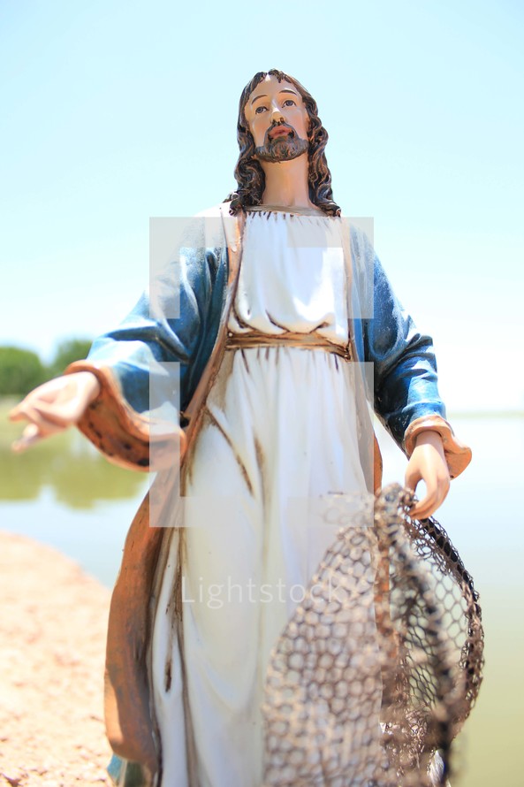 statue of Jesus with a fishing net 