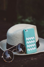 hat, sunglasses, summer, outdoors, table, phone, iPhone, cellphone