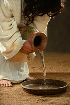 Jesus pouring water 