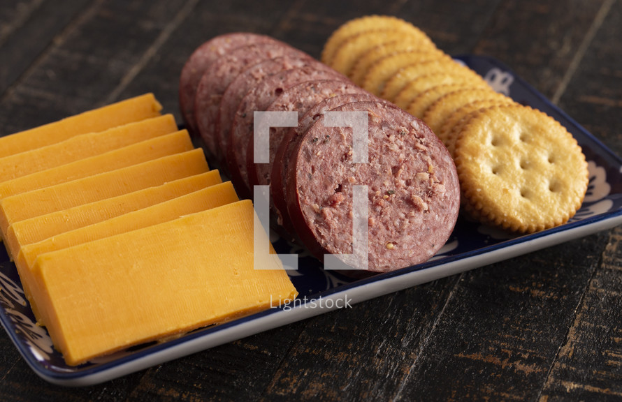 summer sausage, cheese, and cracker tray 