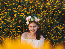 a teen girl in a field of flowers 