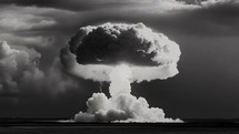 Explosion forming a mushroom cloud in the sky, big nuclear bomb explosion in black and white