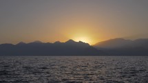 Seascape with mountains and sunset