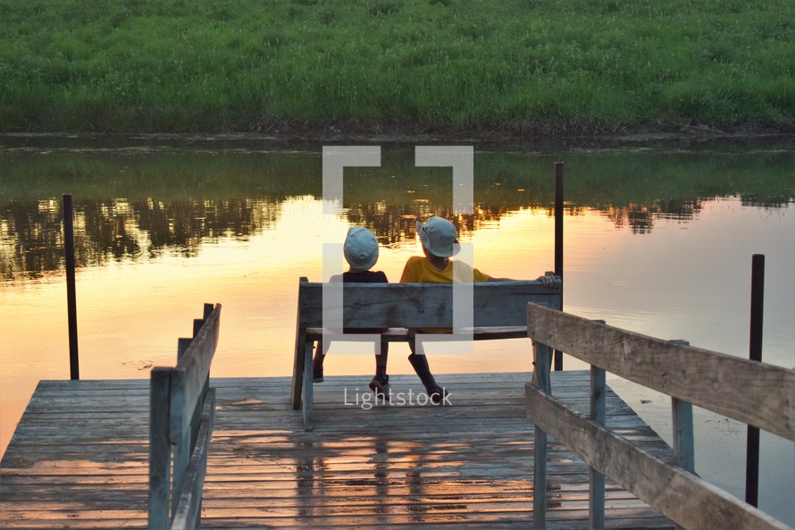 kids sitting on a dock at sunset, brotherly, love, brotherly love, sabbath, rest, sabbath rest, peaceful