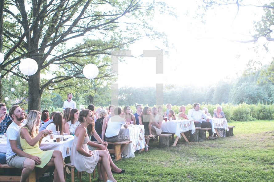 outdoor wedding reception on picnic tables 