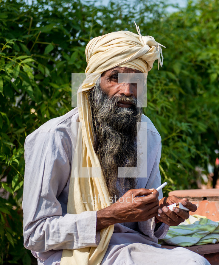 a man smoking a cigarette in India 