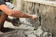 a man troweling concrete 