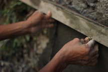 a man working with concrete 