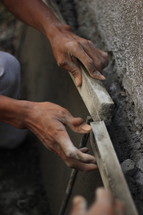a man working with concrete 