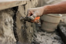 a man troweling concrete 