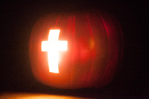 Light of the world pumpkin with cross of Jesus - cross carved in a Jack-O-Lantern pumpkin 