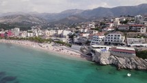 Wide aerial view of coastal shore of Himare, Albania. Beautiful white sand beach