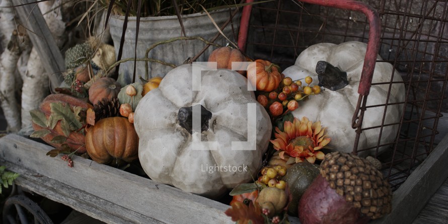 fall decorations in a wooden wagon