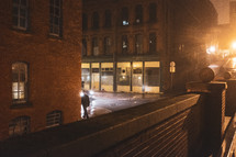 a man walking downtown at night 