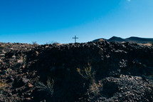 distant cross in a desert landscape 