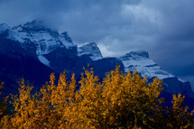 snow on mountain peaks in fall 