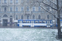 city bus in falling snow 