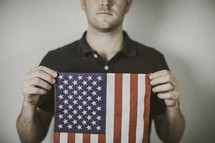 man holding an American flag 