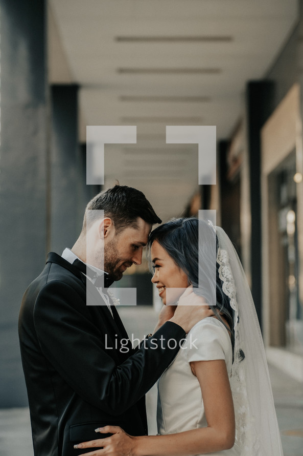 bride and groom portrait in a city 