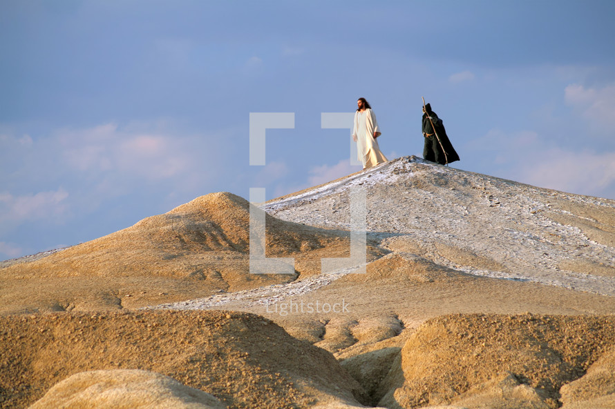 Jesus and Devil on a hill in a Judean desert. Biblical concept.

