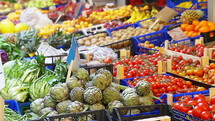 Various fruits and vegetables at a farmer's market.